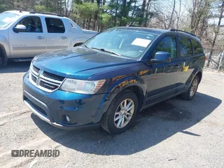 2015 Dodge Journey SXT with VIN 3C4PDDBG1FT701081, listed as a IAAI auction lot 42041392 with 199,683 mi miles and . Bid and sale history available at DreamBid. Image 2.