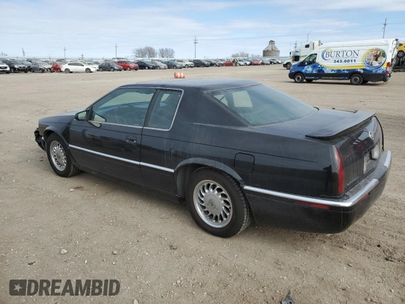 1999 Cadillac Eldorado Touring z VIN 1G6ET1298XU602343, wystawiony jako Copart lot #44327195 z przebiegiem 52 327 mil mil oraz Szkody całkowita. Historia ofert i sprzedaży dostępna na DreamBid. Obrazek 2.