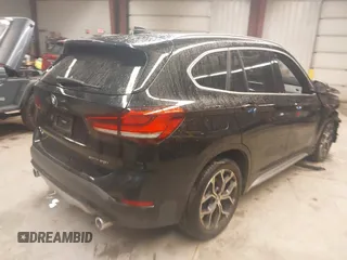 2021 BMW X1 xDrive28i with VIN WBXJG9C00M5T76421, listed as a IAAI auction lot 41918429 with 29,971 mi miles. Bid and sale history available at carsss.com. Image 4.