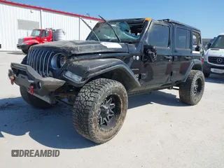 2019 Jeep Wrangler Unlimited Sahara with VIN 1C4HJXEG5KW518202, listed as a IAAI auction lot 41762229 with 91,995 mi miles and . Bid and sale history available at DreamBid. Image 2.