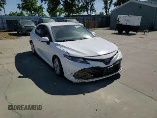 2018 Toyota Camry LE с VIN 4T1B11HK5JU073663, выставлен на аукционе Copart как лот 55656575 с пробегом 100 578 миль миль и Списание • Salvage title. История ставок и продаж доступна на DreamBid. Изображение 13.