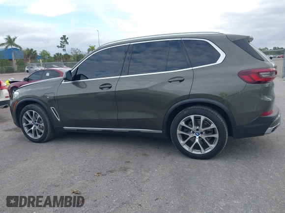 2022 BMW X5 xDrive45e z VIN 5UXTA6C00N9L06383, wystawiony jako IAAI lot #38552162 z przebiegiem 19 592 mil mil oraz . Historia ofert i sprzedaży dostępna na DreamBid. Obrazek 14.