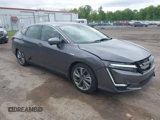 2018 Honda Clarity Touring z VIN JHMZC5F3XJC001054, wystawiony jako IAAI lot #42292688 z przebiegiem 60 780 mil mil oraz . Historia ofert i sprzedaży dostępna na DreamBid. Obrazek 1.