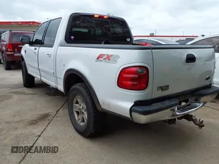 2002 Ford F-150 XLT with VIN 1FTRW08L02KE29411, listed as a IAAI auction lot 42133550 with 270,752 mi miles. Bid and sale history available at carsss.com. Image 3.