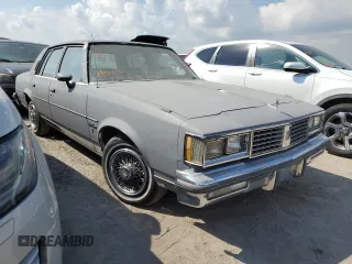 1987 Oldsmobile Cutlass z VIN 2G3GM51Y1H2347545, wystawiony jako Copart lot #76087594 z przebiegiem 98 257 mil mil oraz Szkody całkowita. Historia ofert i sprzedaży dostępna na DreamBid. Obrazek 4.