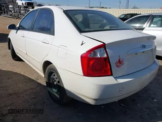 2004 Kia Spectra LX with VIN KNAFE121745036331, listed as a IAAI auction lot 41735613 with 67,634 mi miles. Bid and sale history available at carsss.com. Image 3.