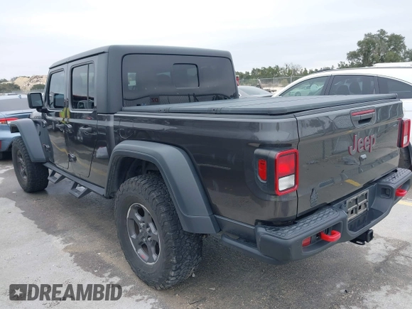 2020 Jeep Gladiator Rubicon with VIN 1C6JJTBG8LL135573, listed as a IAAI auction lot 41585896 with 79,070 mi miles and . Bid and sale history available at DreamBid. Image 3.
