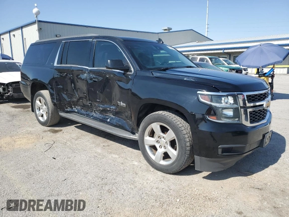 2015 Chevrolet Suburban LT with VIN 1GNSCJKC9FR732720, listed as a Copart auction lot 62564765 with 99,194 mi miles and Salvage title. Bid and sale history available at DreamBid. Image 4.