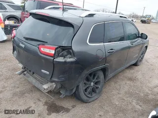 2016 Jeep Cherokee 75th Anniversary with VIN 1C4PJLCB9GW166857, listed as a IAAI auction lot 41435610 with 130,856 mi miles. Bid and sale history available at carsss.com. Image 4.