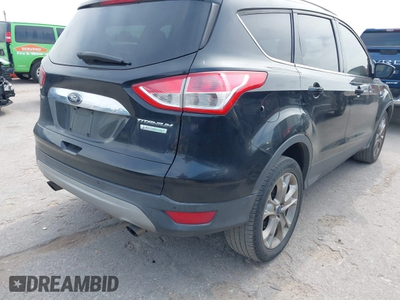 2014 Ford Escape Titanium with VIN 1FMCU0JX5EUB43194, listed as a IAAI auction lot 42084883 with 71,819 mi miles. Bid and sale history available at carsss.com. Image 4.