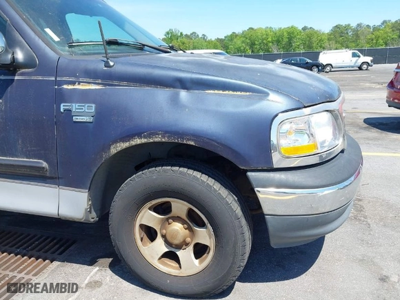 1999 Ford F-150 Work Series with VIN 1FTRX17W9XNB32397, listed as a IAAI auction lot 42048746 with 290,179 mi miles. Bid and sale history available at carsss.com. Image 6.