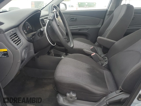 2009 Kia Rio LX with VIN KNADE223496469797, listed as a Copart auction lot 71005774 with 130,675 mi miles and Salvage Title. Bid and sale history available at DreamBid. Image 7.