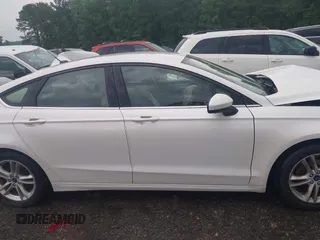 2018 Ford Fusion SE z VIN 3FA6P0H75JR159448, wystawiony jako IAAI lot #42262839 z przebiegiem 144 353 mil mil oraz . Historia ofert i sprzedaży dostępna na DreamBid. Obrazek 13.