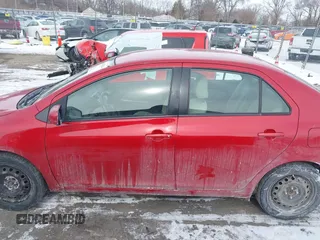 2009 Toyota Yaris with VIN JTDBT903991314767, listed as a IAAI auction lot 41615264 with 252,957 mi miles. Bid and sale history available at carsss.com. Image 14.