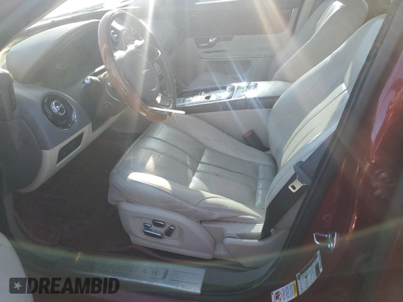 2012 Jaguar XJ with VIN SAJWA1CB3CLV37685, listed as a Copart auction lot 87586005 with 59,885 mi miles and Salvage title. Bid and sale history available at DreamBid. Image 7.