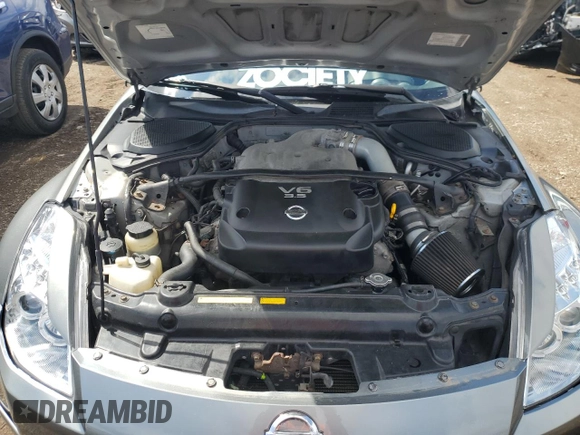 2003 Nissan 350Z Touring z VIN JN1AZ34E23T003943, wystawiony jako Copart lot #55221405 z przebiegiem 198 292 mil mil oraz Szkoda całkowita • Salvage title. Historia ofert i sprzedaży dostępna na DreamBid. Obrazek 11.