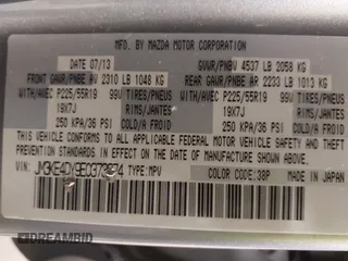 2014 Mazda CX-5 Grand Touring with VIN JM3KE4DY9E0373974, listed as a IAAI auction lot 42073693 with 86,755 mi miles. Bid and sale history available at carsss.com. Image 9.