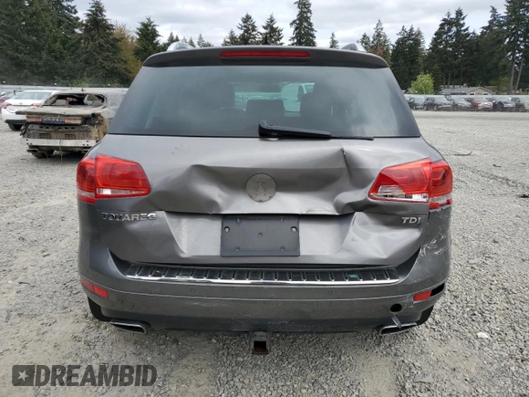 2012 Volkswagen Touareg Sport with VIN WVGFK9BP4CD001860, listed as a Copart auction lot 55090375 with 153,456 mi miles and Salvage title. Bid and sale history available at DreamBid. Image 6.