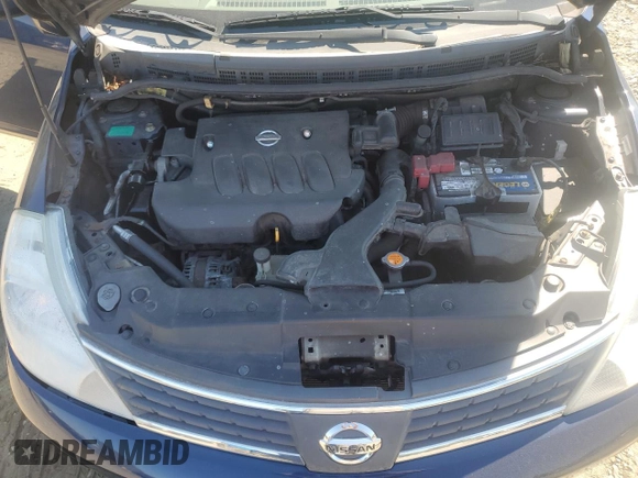 2007 Nissan Versa 1.8 SL with VIN 3N1BC11E27L432802, listed as a Copart auction lot 71018594 with 118,795 mi miles and Salvage Title. Bid and sale history available at carsss.com. Image 12.