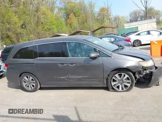 2014 Honda Odyssey Touring with VIN 5FNRL5H92EB073085, listed as a IAAI auction lot 42065913 with 120,834 mi miles and . Bid and sale history available at DreamBid. Image 13.