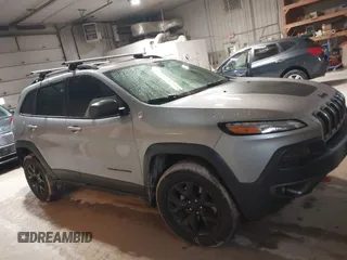 2014 Jeep Cherokee Trailhawk z VIN 1C4PJMBS4EW254963, wystawiony jako IAAI lot #42065845 z przebiegiem 187 356 mil mil oraz . Historia ofert i sprzedaży dostępna na DreamBid. Obrazek 13.