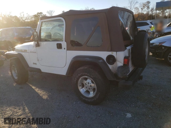 2002 Jeep Wrangler SE with VIN 1J4FA29P82P756330, listed as a Copart auction lot 83659574 with 156,901 mi miles and Salvage Title. Bid and sale history available at DreamBid. Image 2.