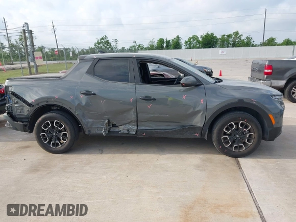 2022 Hyundai Santa Cruz SEL with VIN 5NTJBDAE4NH022823, listed as a IAAI auction lot 42051616 with 23,158 mi miles and . Bid and sale history available at DreamBid. Image 13.