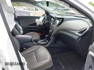 2014 Hyundai Santa Fe z VIN 5XYZUDLB9EG227009, wystawiony jako IAAI lot #42272191 z przebiegiem 97 474 mil mil oraz . Historia ofert i sprzedaży dostępna na DreamBid. Obrazek 5.