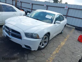 2012 Dodge Charger SE with VIN 2C3CDXBG8CH261739, listed as a IAAI auction lot 41527304 with 104,656 mi miles. Bid and sale history available at carsss.com. Image 2.