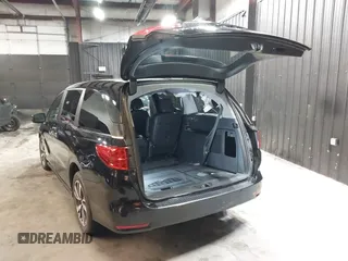 2021 Honda Odyssey Touring with VIN 5FNRL6H83MB040138, listed as a IAAI auction lot 39150096 with 61,322 mi miles and . Bid and sale history available at DreamBid. Image 3.