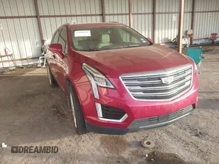 2019 Cadillac XT5 Premium Luxury FWD z VIN 1GYKNERS0KZ157287, wystawiony jako IAAI lot #41106524 z przebiegiem 131 464 mil mil oraz . Historia ofert i sprzedaży dostępna na DreamBid. Obrazek 1.