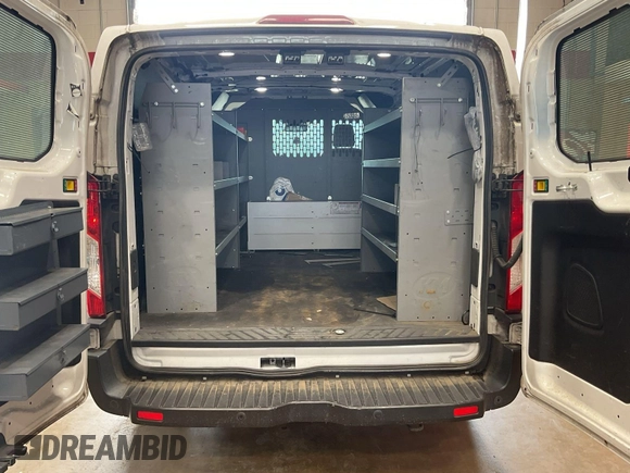 2019 Ford Transit with VIN 1FTYE1YM6KKB31880, listed as a IAAI auction lot 42792031 with 99,943 mi miles and . Bid and sale history available at DreamBid. Image 16.