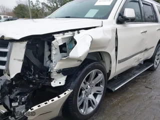 2015 Cadillac Escalade Premium with VIN 1GYS4NKJ9FR547587, listed as a IAAI auction lot 41556378 with 155,038 mi miles. Bid and sale history available at carsss.com. Image 6.