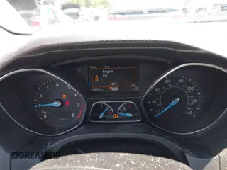 2016 Ford Focus SE z VIN 1FADP3F28GL365676, wystawiony jako IAAI lot #42221665 z przebiegiem 54 899 mil mil oraz . Historia ofert i sprzedaży dostępna na DreamBid. Obrazek 7.