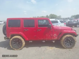 2012 Jeep Wrangler Unlimited Sahara with VIN 1C4HJWEGXCL209449, listed as a IAAI auction lot 41864432 with 100,917 mi miles. Bid and sale history available at carsss.com. Image 13.