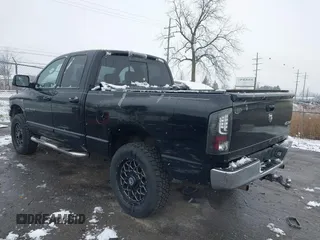 2006 Dodge 1500 SLT with VIN 1D7HU18256J142677, listed as a IAAI auction lot 41159900 with 236,662 mi miles. Bid and sale history available at carsss.com. Image 3.
