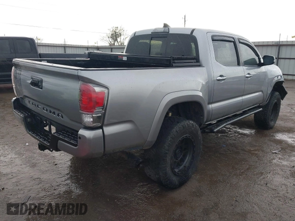 2018 Toyota Tacoma SR with VIN 5TFGZ5AN4JX142565, listed as a IAAI auction lot 41353718 with 87,544 mi miles and . Bid and sale history available at carsss.com. Image 4.