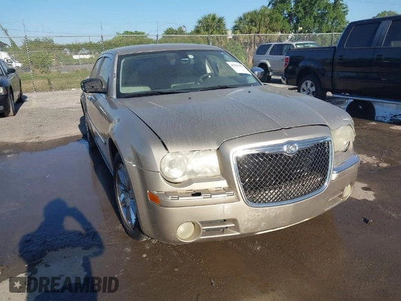2009 Chrysler 300 Limited with VIN 2C3KA33V99H592963, listed as a IAAI auction lot 42041417 with 160,829 mi miles. Bid and sale history available at carsss.com. Image 1.