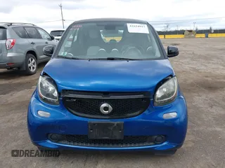 2016 Smart fortwo Passion z VIN WMEFJ5DA8GK059871, wystawiony jako IAAI lot #41624917 z przebiegiem 90 906 mil mil oraz . Historia ofert i sprzedaży dostępna na DreamBid. Obrazek 12.