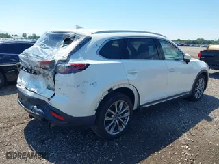 2016 Mazda CX-9 Grand Touring with VIN JM3TCBDY7G0125708, listed as a IAAI auction lot 39891843 with 133,988 mi miles. Bid and sale history available at carsss.com. Image 4.