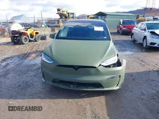 2022 Tesla Model X Plaid z VIN 7SAXCBE6XNF358023, wystawiony jako IAAI lot #41683857 z przebiegiem 42 821 mil mil oraz . Historia ofert i sprzedaży dostępna na DreamBid. Obrazek 13.