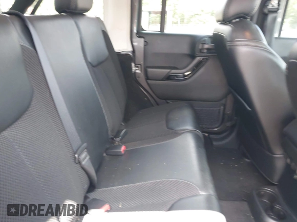 2017 Jeep Wrangler Unlimited Sahara with VIN 1C4BJWEG4HL605213, listed as a IAAI auction lot 42247221 with 104,542 mi miles and . Bid and sale history available at DreamBid. Image 8.
