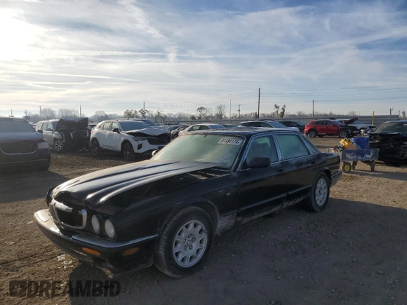 1998 Jaguar XJ with VIN SAJHX1245WC819762, listed as a Copart auction lot 81480174 with 132,491 mi miles and Salvage title. Bid and sale history available at DreamBid. Image 1.