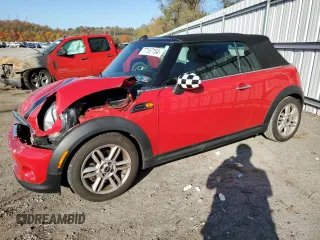 2013 MINI Convertible with VIN WMWZN3C58DT265980, listed as a Copart auction lot 77157154 with 88,975 mi miles and Salvage Title. Bid and sale history available at DreamBid. Image 1.