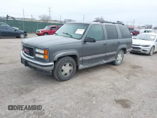 1999 GMC Yukon with VIN 1GKEK13R0XJ803237, listed as a IAAI auction lot 41736117 with 295,793 mi miles. Bid and sale history available at carsss.com. Image 2.