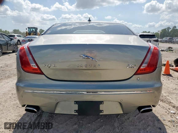 2013 Jaguar XJ Portfolio with VIN SAJWJ2GD5D8V49505, listed as a Copart auction lot 61171955 with 129,158 mi miles and Salvage title. Bid and sale history available at DreamBid. Image 6.