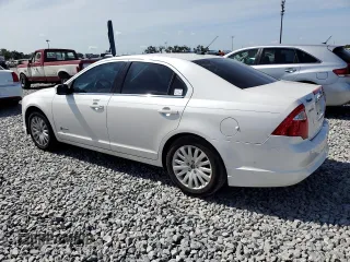 2010 Ford Fusion Hybrid с VIN 3FADP0L3XAR142883, выставлен на аукционе Copart как лот 64308015 с пробегом 67 890 миль миль и Чистый • Clean title. История ставок и продаж доступна на DreamBid. Изображение 2.