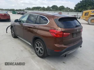 2016 BMW X1 xDrive28i with VIN WBXHT3C31GP880132, listed as a Copart auction lot 69129132 with 74,759 mi miles. Bid and sale history available at carsss.com. Image 3.