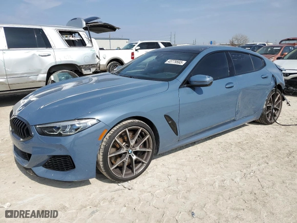 2022 BMW 8 Series M850i with VIN WBAGV8C06NCH98097, listed as a Copart auction lot 43779565 with 18,740 mi miles and Salvage Title. Bid and sale history available at carsss.com. Image 1.