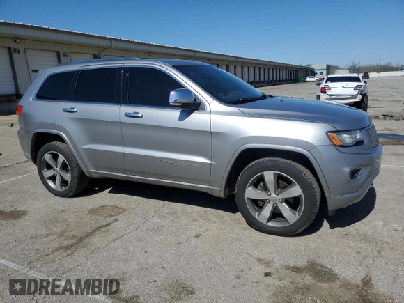 2014 Jeep Grand Cherokee Overland with VIN 1C4RJFCG0EC542527, listed as a Copart auction lot 51776655 with 167,703 mi miles and Salvage Title. Bid and sale history available at DreamBid. Image 4.